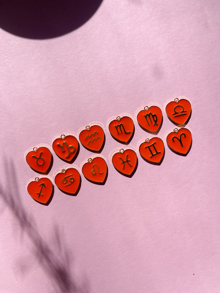
                
                    Load image into Gallery viewer, Single Orange Heart Zodiac Huggie
                
            